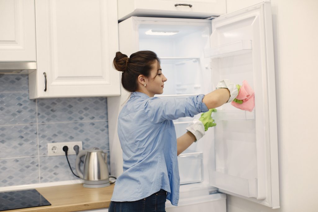 woman-cleaning-the-fridge