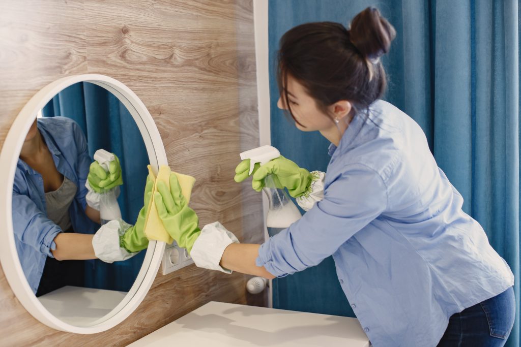 woman-cleaning-mirrors-and-windows