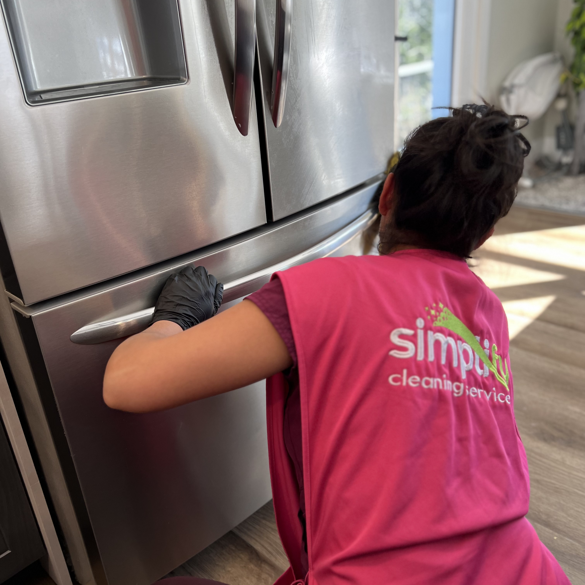 Kitchen being cleaned by Simplify professionals