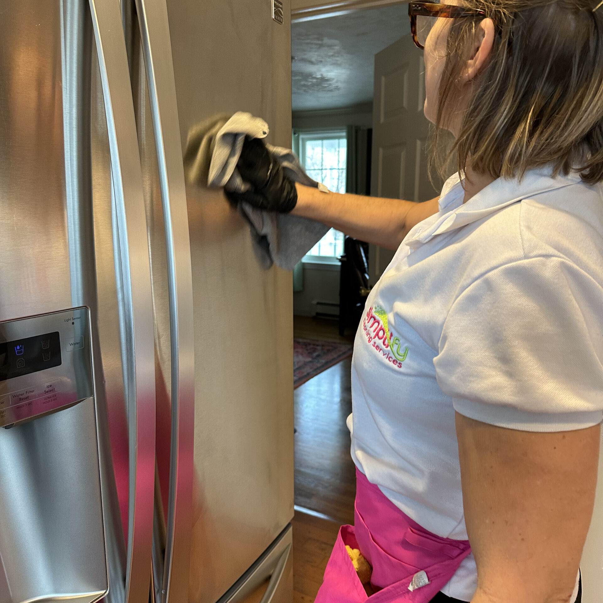 Refrigerator being cleaned by a professional from Simplify Cleaning
