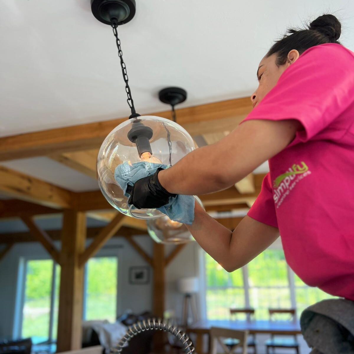 Simplify Cleaning expert doing the necessary cleaning on a home